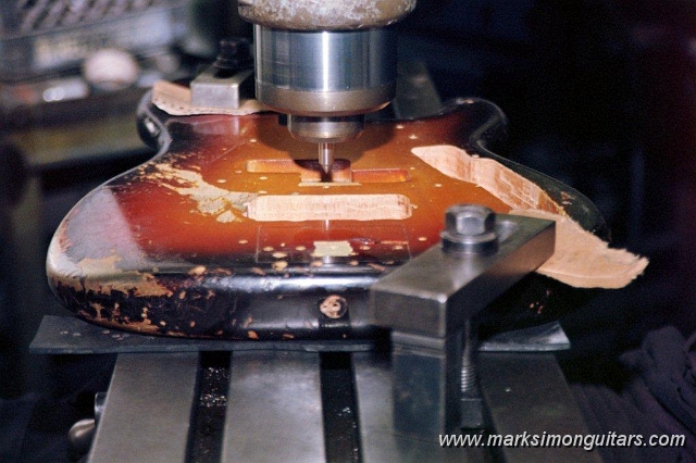 20_0021.jpg - Body is placed on the milling machine to determine X and Y centering axis.